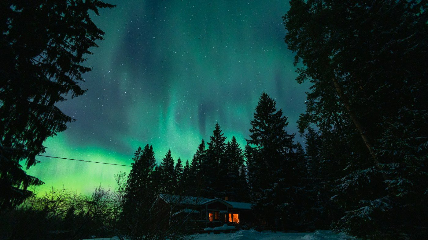 Northern lights above a cabin in Finland